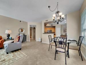 a dining room and living room with a table and chairs at Mountain View #312 Surprise in Surprise