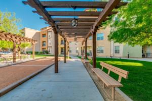 a pergola with benches in front of a building at Mountain View #312 Surprise in Surprise