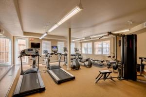 a gym with treadmills and cardio equipment in a room at Mountain View #312 Surprise in Surprise