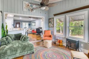 a living room with a couch and a fireplace at Fish, Swim and Grill Lakefront Carolina Home! in Lake Waccamaw