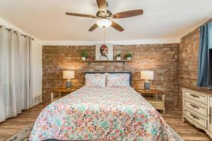 a bedroom with a bed and a ceiling fan at Full Triplex in Central Tucson EV charging in Tucson