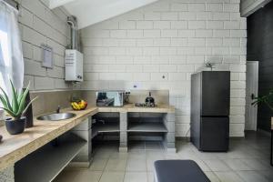 Η κουζίνα ή μικρή κουζίνα στο Dolphin Coast Stay +11 φωτογραφίες