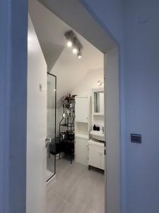 a white bathroom with a sink and a mirror at Wohnung in Zentrum Bonn in Bonn +23 photos