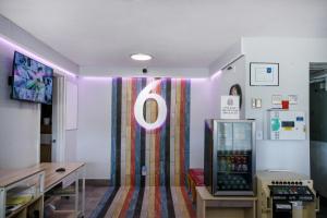 a room with a large o sign on the wall at Home 6 by Townhouse Topeka KS I 70 in Topeka +34 photos