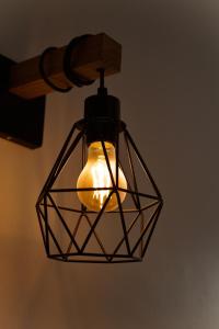 aendant light hanging from a ceiling at Eloura Homes Stanley Studio in Kiambu +5 photos