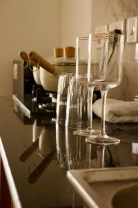 two empty wine glasses sitting on a kitchen counter at Eloura Homes Stanley Studio in Kiambu