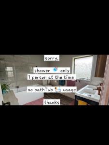 a picture of a bathroom with a sink and a mirror at private entrance, bathroom,great views of the lake in Taupo
