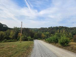 a dirt road in the middle of a field at The Hocking Hills Store Campsite #3 in Logan