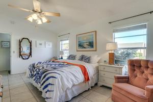 a bedroom with a bed and a chair and a window at Pool Access Condo 4 Mi to Bradenton Riverwalk! in Cedar Hammock +20 photos