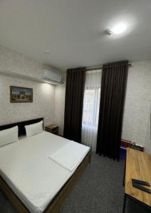 Fotografie z fotogalerie ubytování Azizbek INN Hotel White v destinaci Yakkasaray