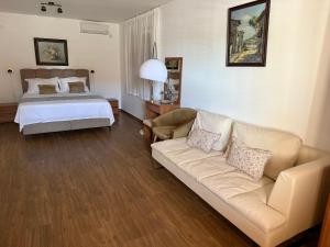 a living room with a couch and a bed at VILLA V&D in Milna +37 photos