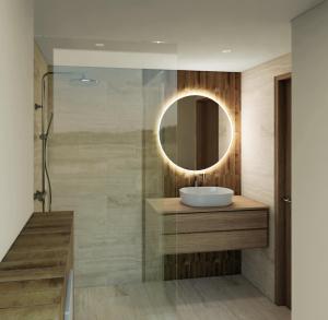 a bathroom with a sink and a mirror at Hotel Princeps in Sátoraljaújhely