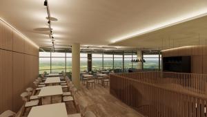 a restaurant with tables and chairs and large windows at Hotel Princeps in Sátoraljaújhely +17 photos