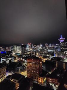 a view of a city at night with at Historic Downtown Escape in Vancouver