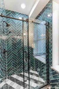 a shower with a glass door in a bathroom at Large Studio w 2 Beds and Balcony (C) in Philadelphia