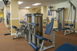 a gym with several treadmills and machines at Players Club Resort in Hilton Head Island