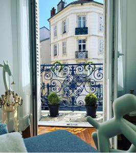 a view of a building from a window at La suite de la pépinière in Nancy