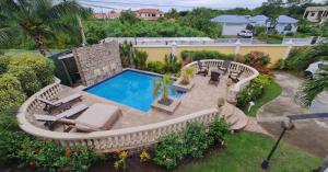 an aerial view of a backyard with a swimming pool at Jasmine Villas #7 in Castries