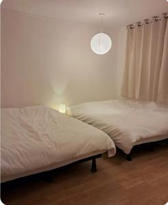 Ένα ή περισσότερα κρεβάτια σε δωμάτιο στο Sodam stay