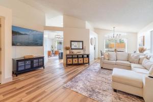 a living room with a couch and a table at Modern Western Retreat Pet Friendly 4 Bed 2 Bath in Reno