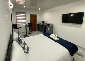 Ένα ή περισσότερα κρεβάτια σε δωμάτιο στο The Palms Guest House