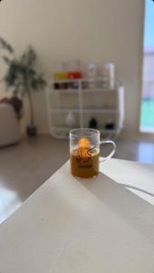 a cup of coffee sitting on a table at Marbella Resort in Al Ain