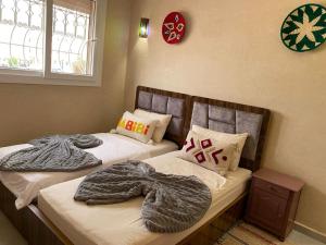 Postel nebo postele na pokoji v ubytování taghoba surf house