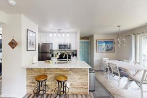 a kitchen with a counter and a table with chairs at Bridgewater Sanctuary in Avon