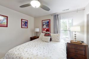 a bedroom with a bed and a ceiling fan at Bridgewater Sanctuary in Avon