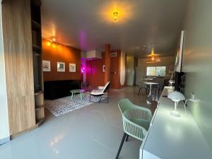 a living room with a table and chairs in a room at Eddys in Chihuahua