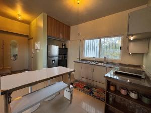 a large kitchen with a counter and a sink at Eddys in Chihuahua