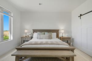 a bedroom with a large bed with two night stands at Book the Entire Eleanor Inn in Walla Walla