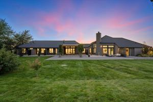 a large house with a lawn in front of it at Cleo Suite in Walla Walla