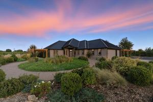 a house with solar panels on the roof at Cleo Suite in Walla Walla