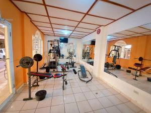 a gym with many exercise equipment in a room at Hotel Continental Plaza in San Miguel
