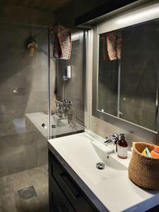 a bathroom with a sink and a shower at Modern Cabin In Norefjell With Sauna in Surteberg +12 photos