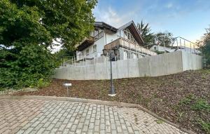 a house with a stone driveway in front of it at Nice Apartment In Südharz With Sauna in Stolberg i. Harz