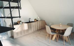 a dining room with a wooden table and chairs at A-FRAME Ξυλόκαστρο 