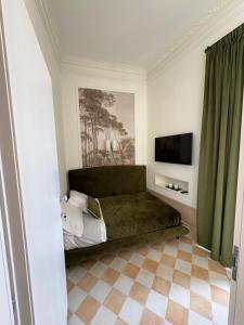 a bedroom with a couch and a television in it at Gradini dell arte in Naples +53 photos