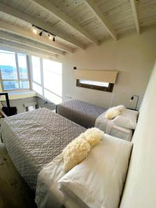 Postel nebo postele na pokoji v ubytování Merinos Lodge 1