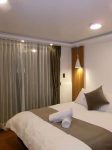 Una cama o camas en una habitación de Hesed Hospedaje 8 fotos más