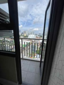 a view from an open door of a balcony at Nica's Place in Cebu City
