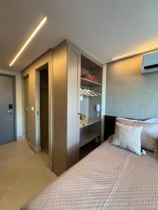 a bedroom with a large bed and a closet at Setai, Aquamaris- pé na areia in João Pessoa +37 photos
