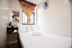 Letto o letti in una camera di Sun Guest House