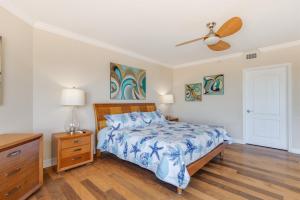 a bedroom with a bed and a ceiling fan at 3BR Luxury Penthouse Panoramic Views in St Pete Beach +29 photos