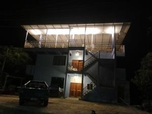 a building with a staircase at night at ชมวิว บึงโขงหลง in Bung Khong Long +1 photo