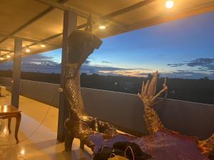 a statue of a dinosaur on a balcony at ชมวิว บึงโขงหลง in Bung Khong Long