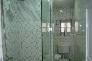 Koupelna v ubytování EH Apartments + 13 fotografií