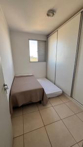 Postel nebo postele na pokoji v ubytování Apartamento Veneza + 8 fotografií