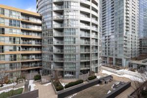 an aerial view of a large building with tall buildings at Stylish 1BR Condo with Patio Steps from Waterfront in Toronto +32 photos